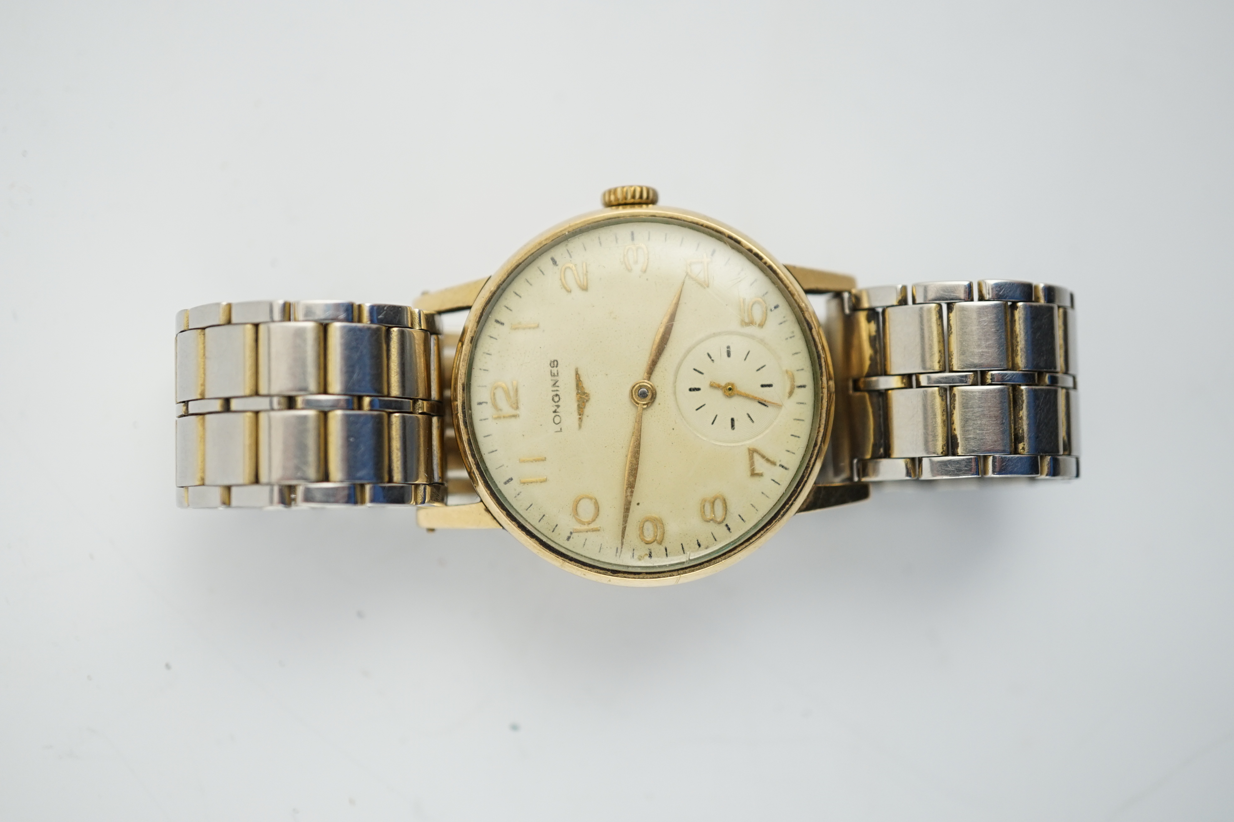 A gentleman's late 1950's 9ct gold Longines manual wind wrist watch